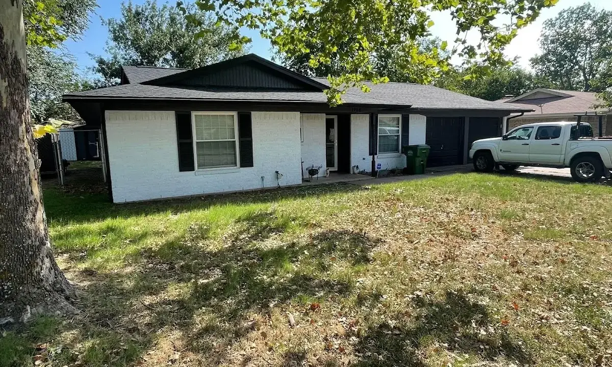 Professional roofing crew working on a residential roof in Avenal